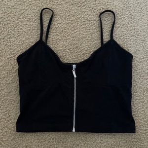 tight fitting black crop top with fully functional zipper in the front